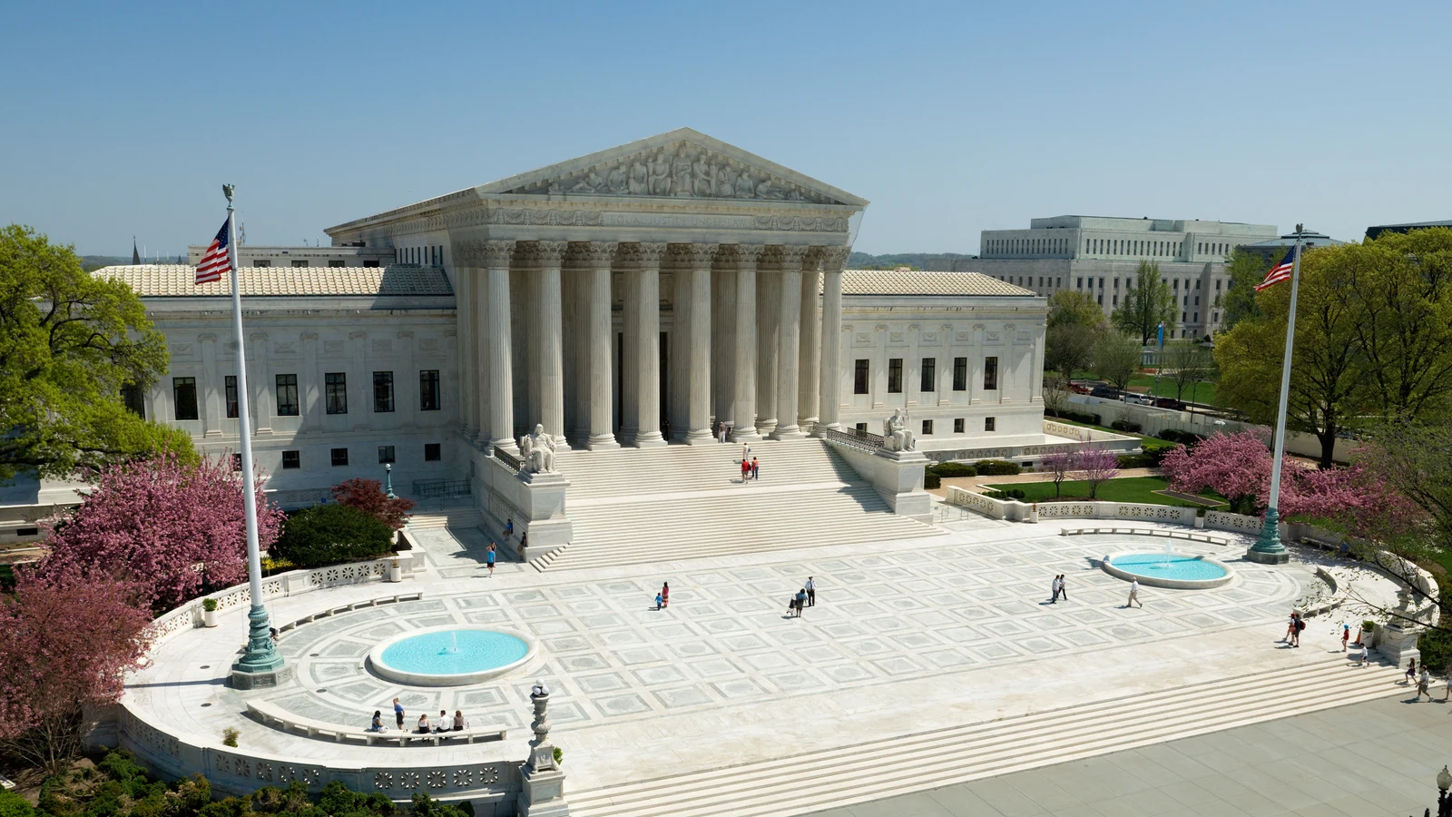 Front of the U.S. Supreme Court Building with its broad steps, columns and triangular pediment.